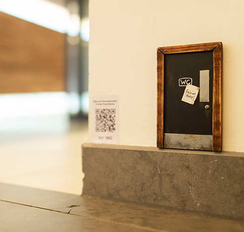 Miniatures Model-making:  Tiny public bathroom door exhibited in Bristol Cabot Circus shopping centre